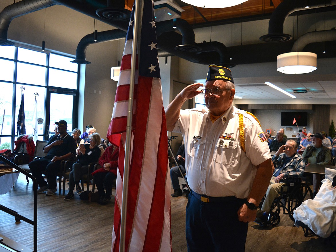 Ryan Bledsoe salutes the flag as a member of the Idaho Veterans League honor guard during a presentation of Quilts of Valor Monday at the Idaho State Veterans Home in Post Falls.