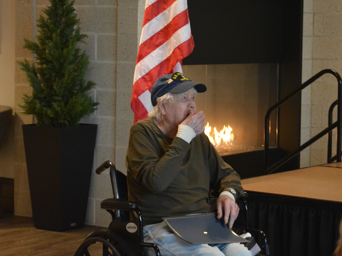 Herman Shoopman reacts to seeing his personalized quilt of valor Monday morning at the Idaho State Veterans Home.