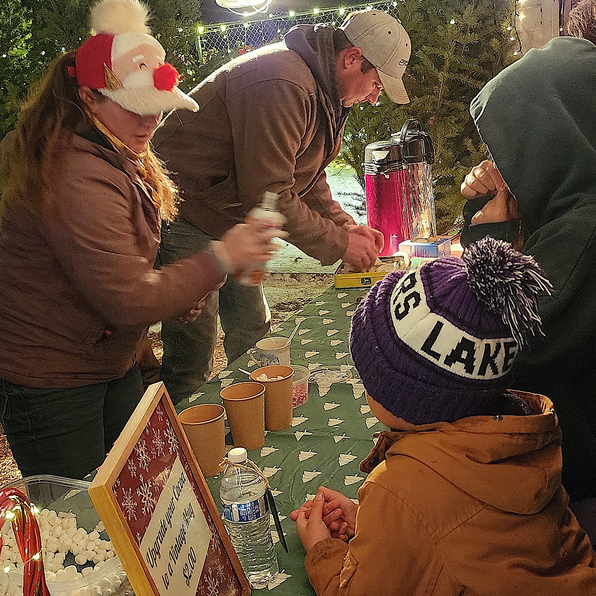 Hot cocoa and coffee were good sellers for the Farrand family at Lights Under the Big Sky last weekend. (Berl Tiskus/Leader)