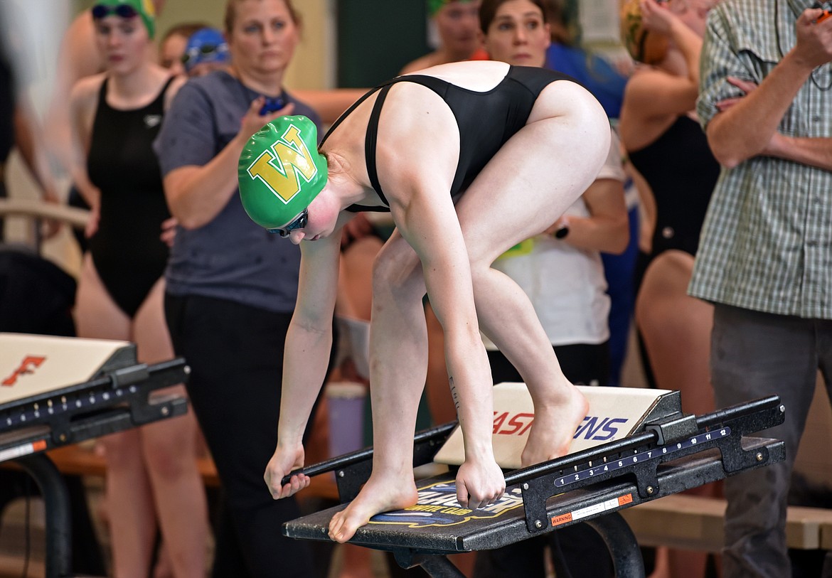 A Whitefish swimmer on the blocks at the meet in Kalispell Dec. 14. (Kelsey Evans/Whitefish Pilot)