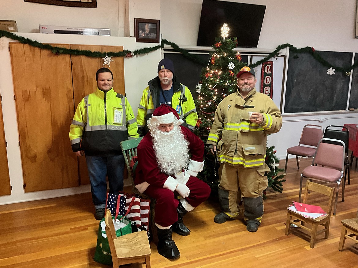 The West End Volunteer Fire Department stopped by for some Christmas cheer with Santa in between his visits with children. (Bruce Charles photos)