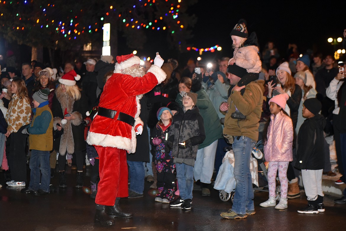 Santa appears at the Christmas Stroll. (Kelsey Evans/Whitefish Pilot)