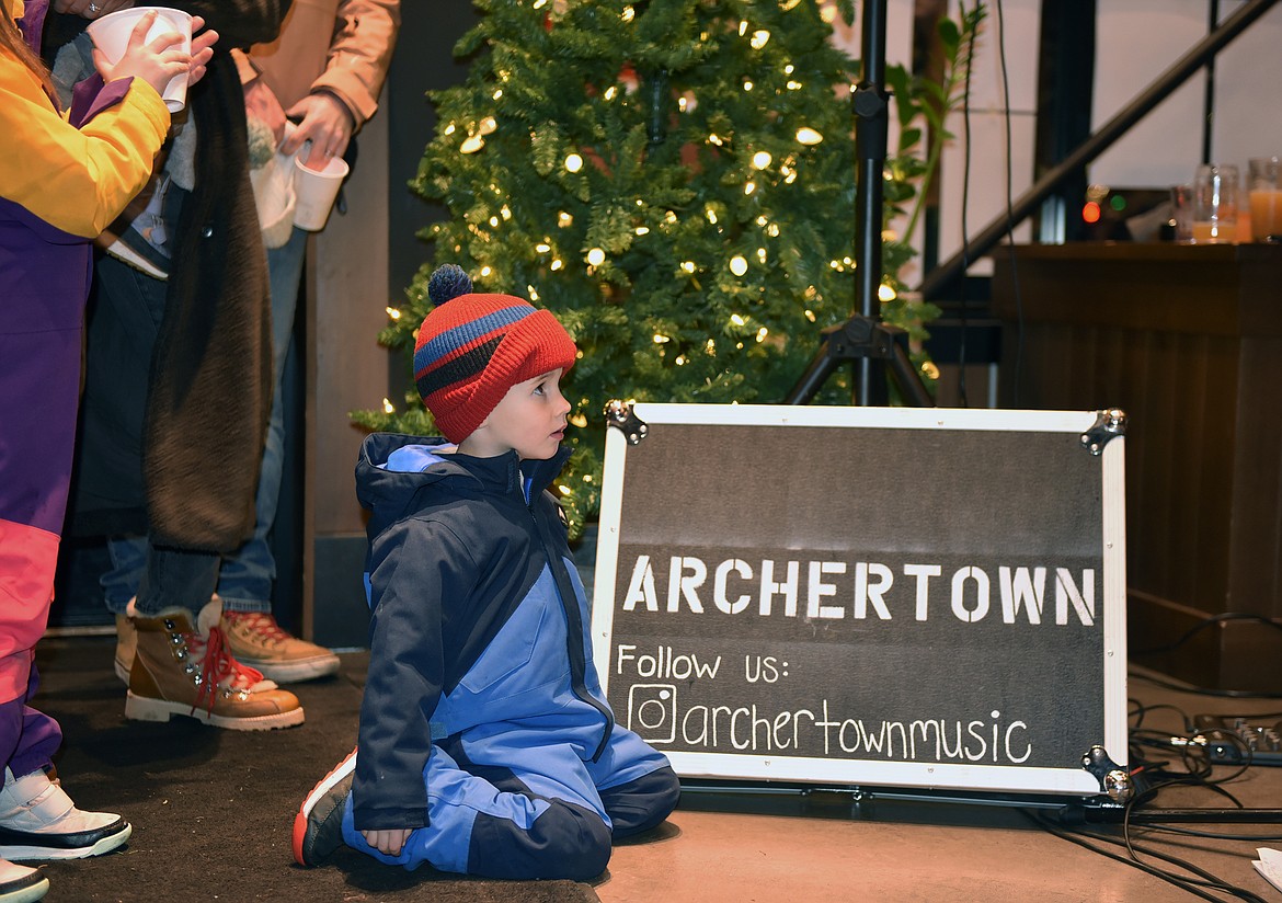 Watching Archertown perform inside of Blackstar during the Christmas Stroll on Friday. (Kelsey Evans/Whitefish Pilot)