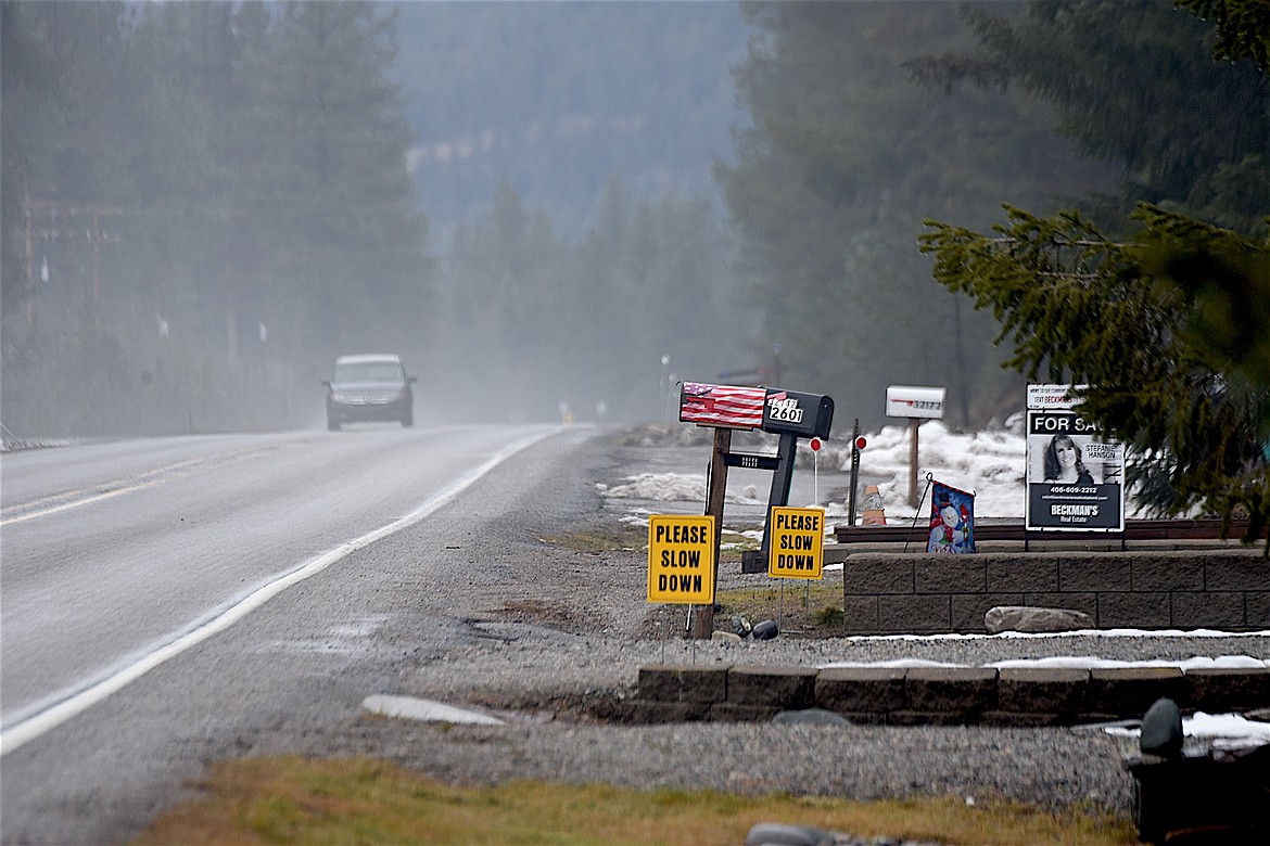 Some residents in the Savage Lake area of Bull Lake Road have placed signs urging motorists to slow down. They are seeking a reduction in the speed limit. (Scott Shindledecker/The Western News)