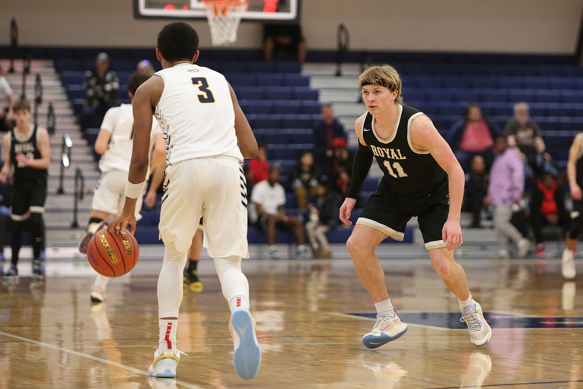 Royal senior Lance Allred keeps his eyes on an Annie Wright player during last season’s regional game in Tacoma. Head Coach Greg Jenks noted Allred has stepped up on the defensive end of the court for the Knights this season.