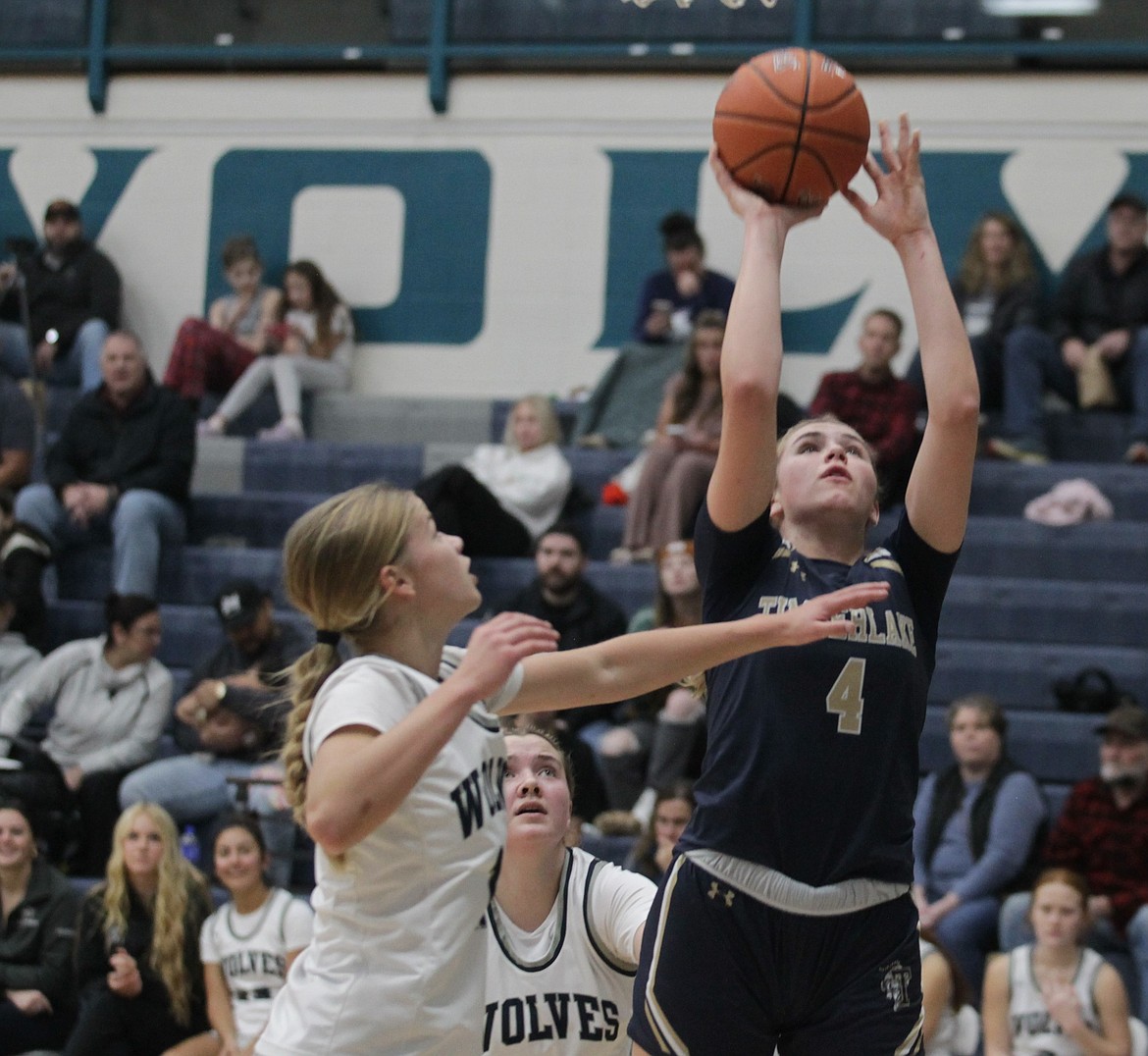 JASON ELLIOTT/Press
Timberlake senior Diana Nelson puts up a shot over the defense of Lake City's Ella Pearson during the first quarter of Tuesday's game at Lake City High.