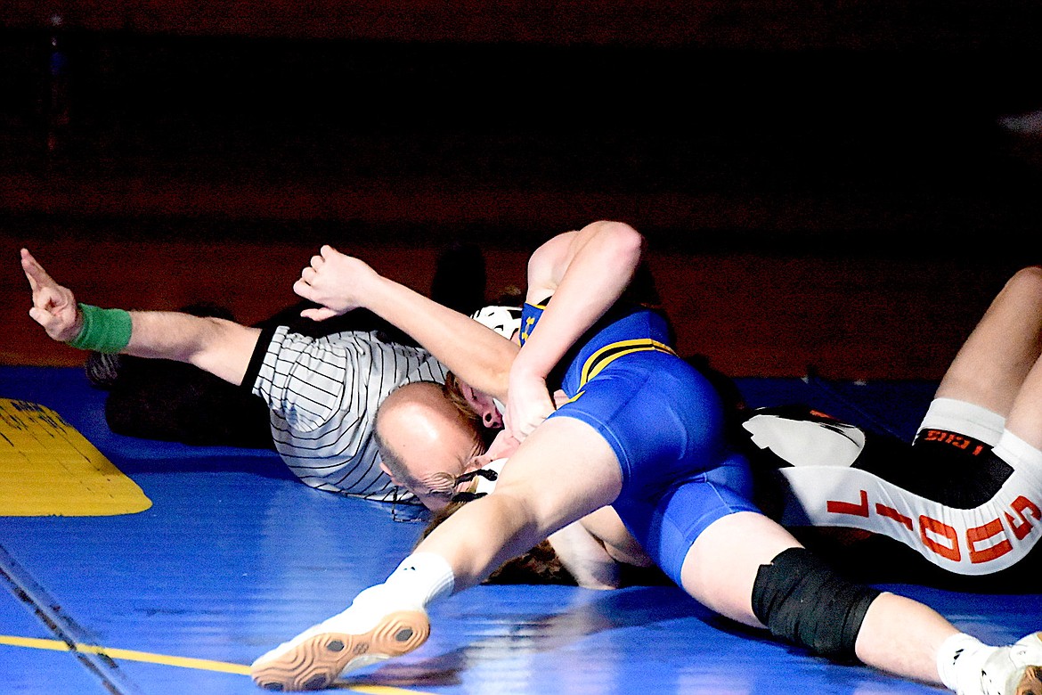 Libby wrestler Boe Miles has Eureka's Josh Lambertson in trouble during their 150-pound match Tuesday, Dec. 18, 2024, at Libby Middle High School. Miles won a 12-9 decision. (Scott Shindledecker/The Western News)