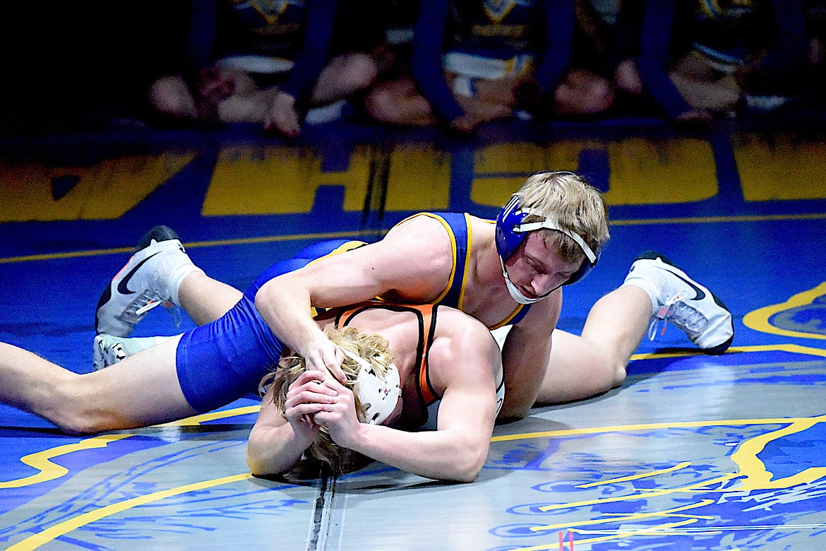 Libby wrestler Tanner Wolfe battles Eureka's Rogan Lytle during their 175-pound match Tuesday, Dec. 18, 2024, at Libby Middle High School. Lytle won a 7-6 decision. (Scott Shindledecker/The Western News)