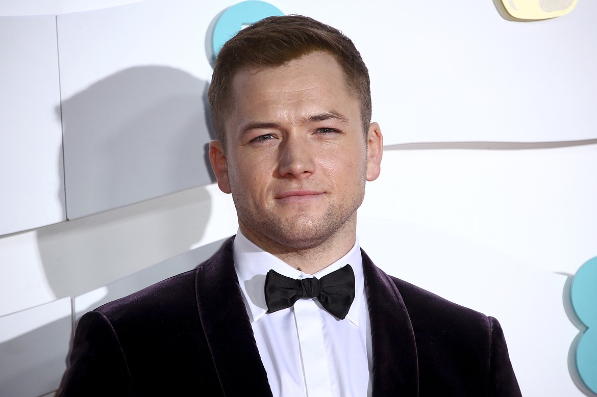 Actor Taron Egerton poses for photographers upon arrival at the Bafta Film Awards in central London, Feb. 2, 2020. Egerton stars in a new action thriller, "Carry-On," that gives solid "Die Hard" vibes.