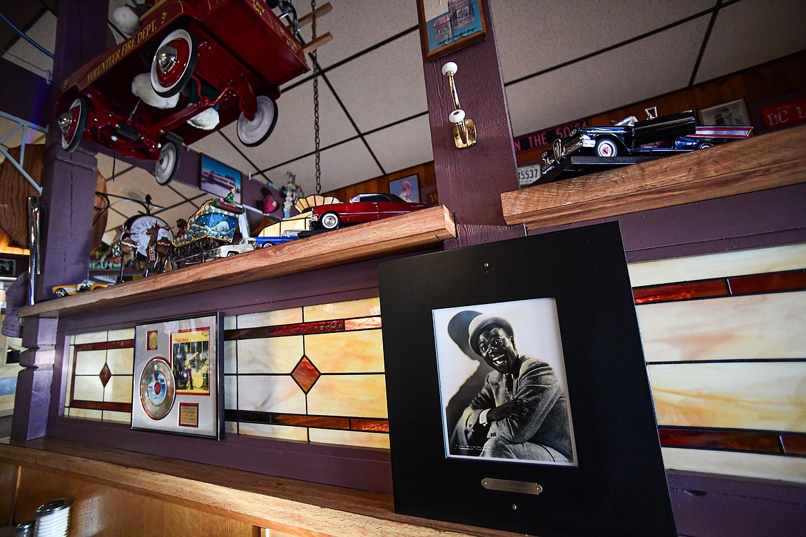 A framed picture of American actor, tap dancer and singer Bill "Bojangles" Robinson hangs above a table at Bojangles Diner in Kalispell on Thursday, Dec. 19. (Casey Kreider/Daily Inter Lake)