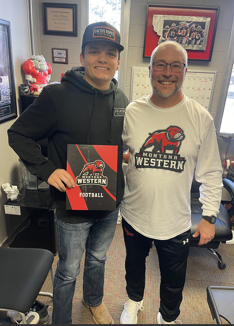 Courtesy photo
Coeur d'Alene High senior Isaac Rook recently signed a letter of intent to play football at NAIA Montana Western University in Dillon, Mont. Pictured is Isaac Rook, left, and Montana Western head football coach Ryan Nourse.