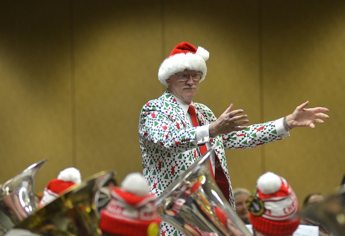 Allen Slater, retired Flathead High School band director, conducts the band Dec. 16 for the TubaChristmas concert at the Red Lion Hotel. (Heidi Desch/Daily Inter Lake)