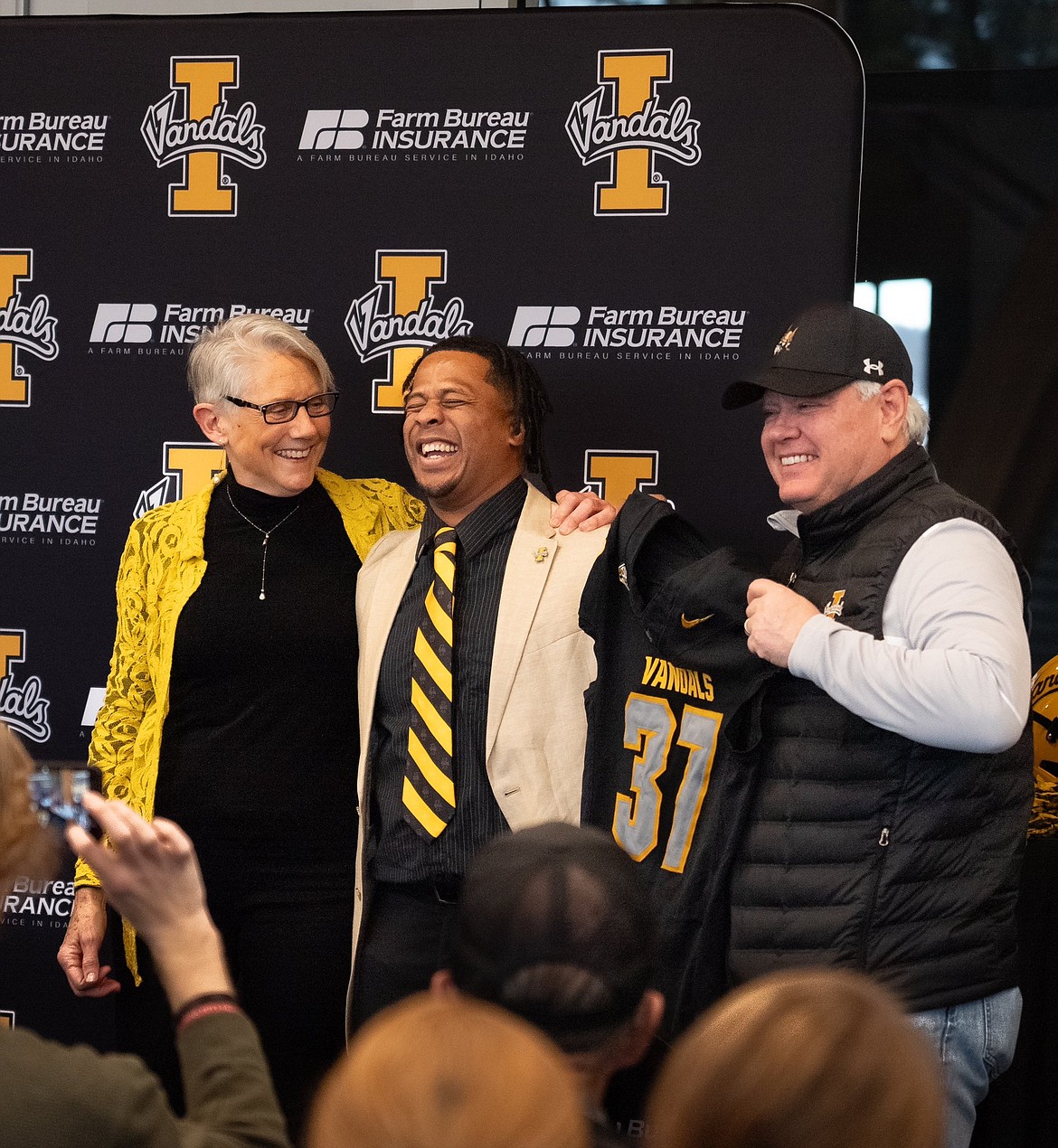 Photo by IDAHO ATHLETICS
Idaho athletic director Terry Gawlik, left, and president C. Scott Green, right, welcome Thomas Ford Jr. as the new Idaho head football coach Friday in Moscow.