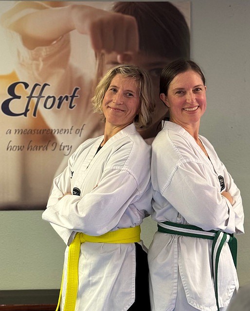 From left, Ammi Midstokke (Yellow Belt) and Birgitta Hughes (Green Stripe Belt) recently passed their belt tests at Sandpoint Martial Arts.