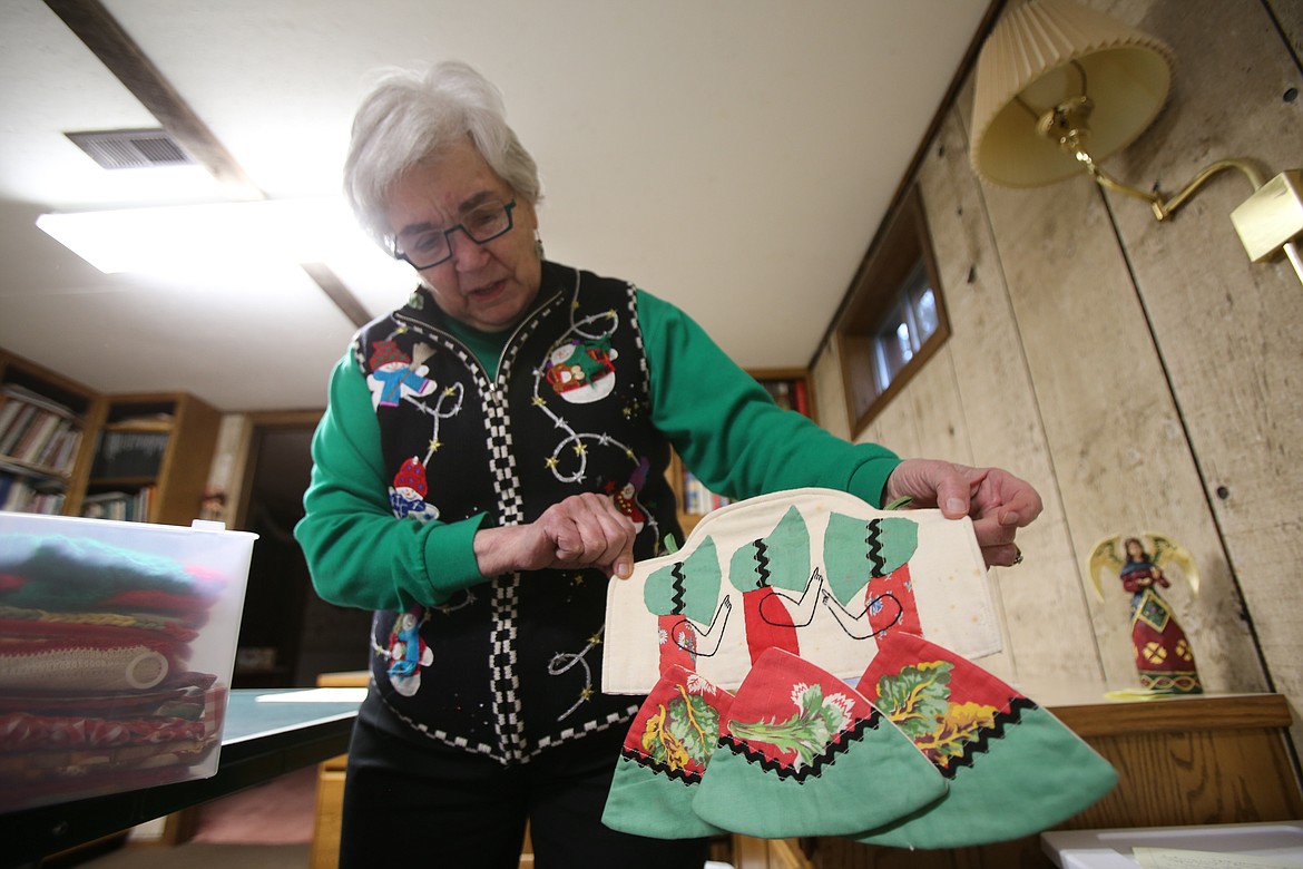 A handmade vintage potholder depicting girls with swinging skirts is one of the many unique items in Ginger Wright's potholder collection.