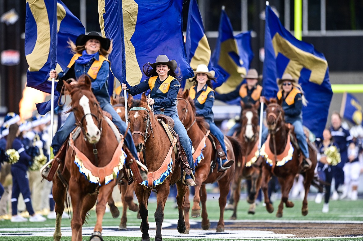 Horseback riders enter the field during the Montana State Runout before an FCS semifinal game against South Dakota at Bobcat Stadium on Saturday, Dec. 21. (Casey Kreider/Daily Inter Lake)