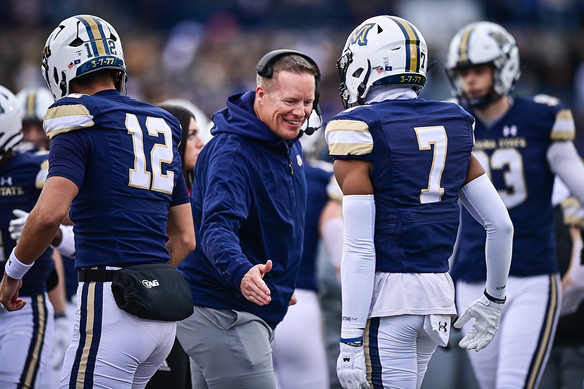 Montana State head coach Brent Vigen congratulates his team after a first-quarter touchdown during an FCS semifinal game against South Dakota at Bobcat Stadium on Saturday, Dec. 21. (Casey Kreider/Daily Inter Lake)