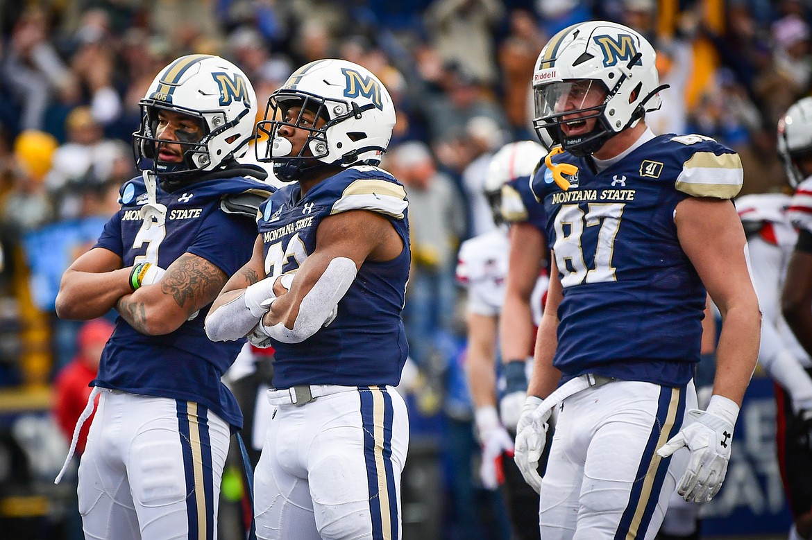 Montana State's Lonyatta Alexander Jr. (2), Scottre Humphrey (22) and Ryan Lonergan (87) celebrate after Humphrey's 1-yard touchdown run in the second quarter during an FCS semifinal game against South Dakota at Bobcat Stadium on Saturday, Dec. 21. (Casey Kreider/Daily Inter Lake)