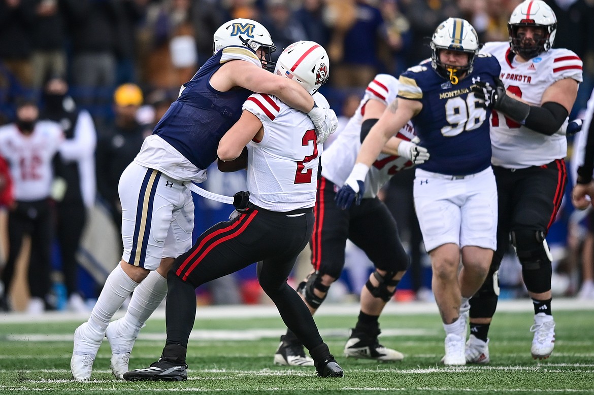 Montana State defensive end Kenneth Eiden IV (11) sacks South Dakota quarterback Aiden Bouman (2) in the second quarter during an FCS semifinal game against South Dakota at Bobcat Stadium on Saturday, Dec. 21. (Casey Kreider/Daily Inter Lake)