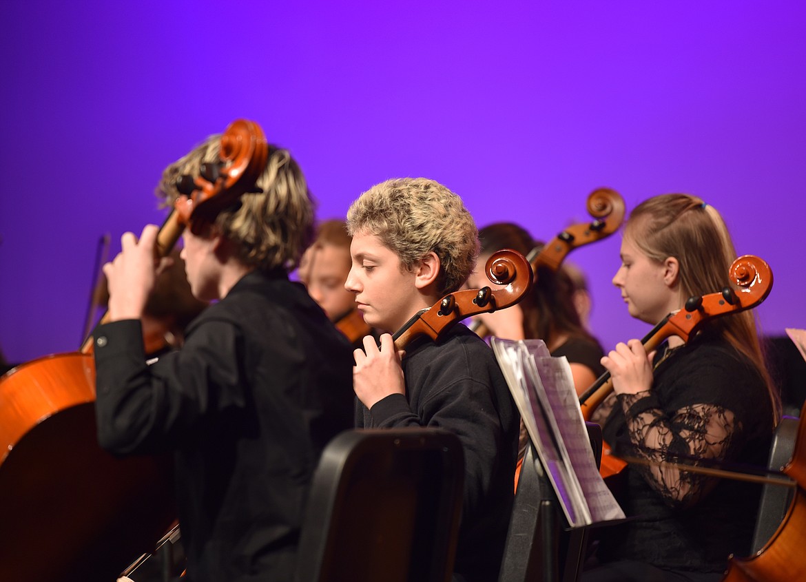 From left to right are eighth grade cellists Darien Sorensen, Theo Kanter and Chana Melnick. (Kelsey Evans/Whitefish Pilot)