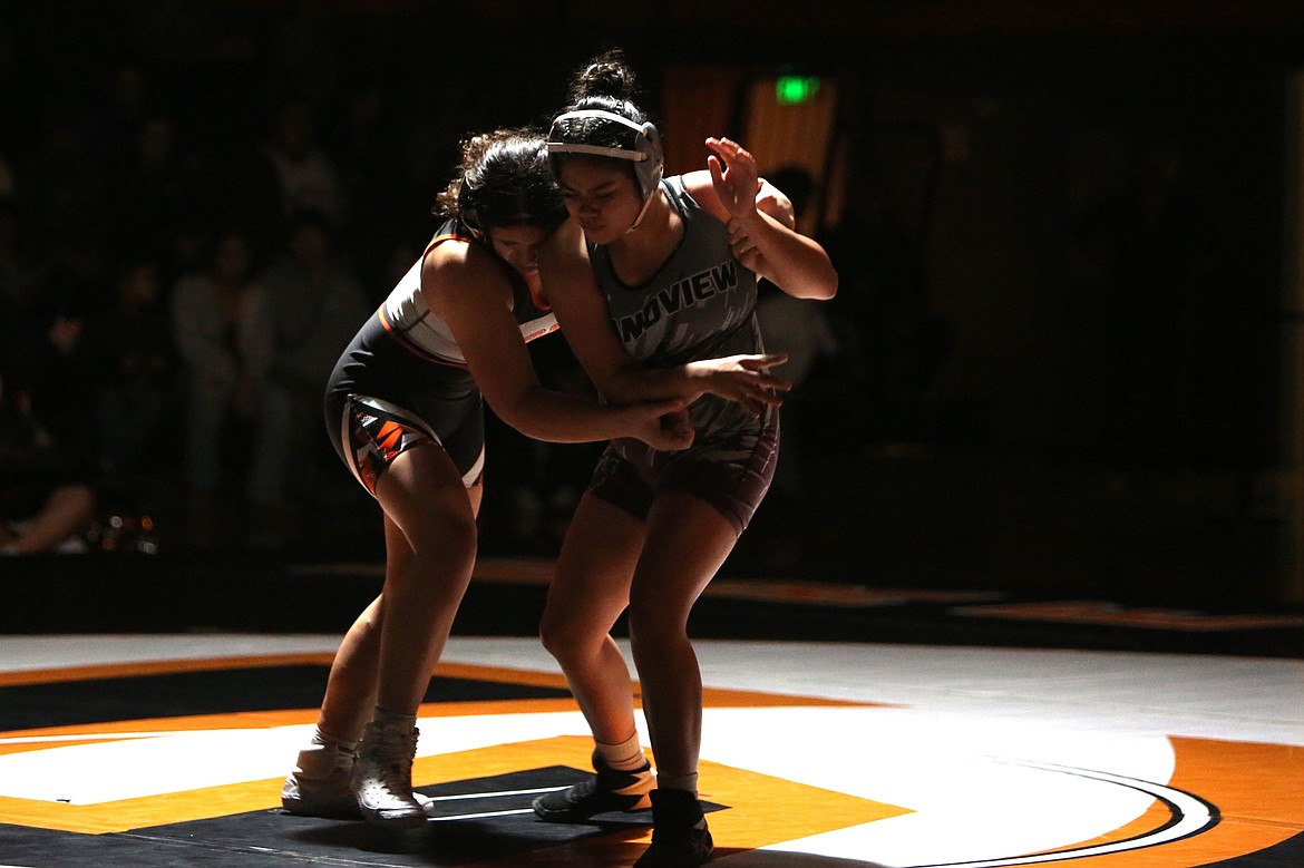 Ephrata junior Rayn Castillo, left, aims to take down Grandview’s Keyla Hernandez. Castillo won the match in the second round via technical fall.