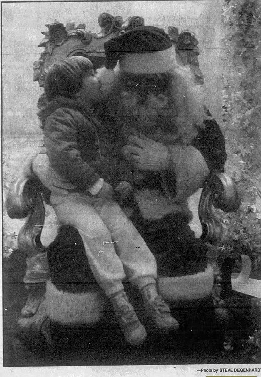 This photo from Nov. 30, 1989 shows a young Coeur d'Alene boy sharing his Christmas wishes with Santa at the Coeur d'Alene Resort.