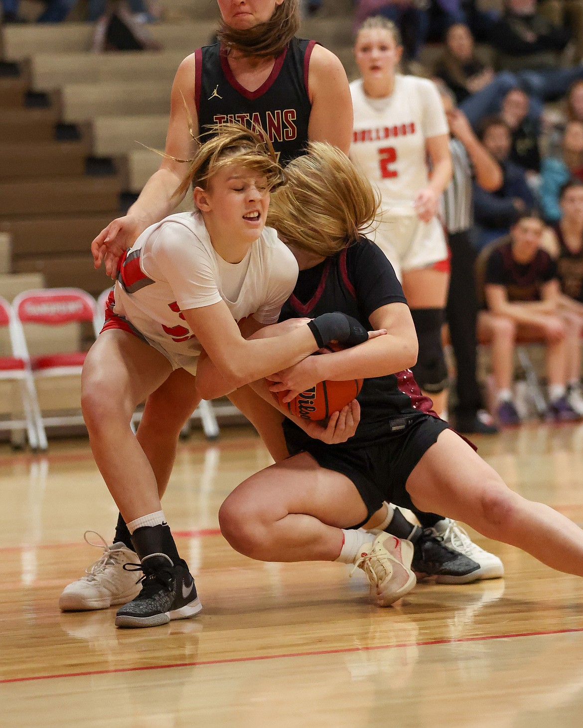 JASON DUCHOW PHOTOGRAPHY
Sandpoint junior Mia Driggs and University sophomore Keely Handran fight for possession of the ball during Saturday's game at Les Rogers Court.