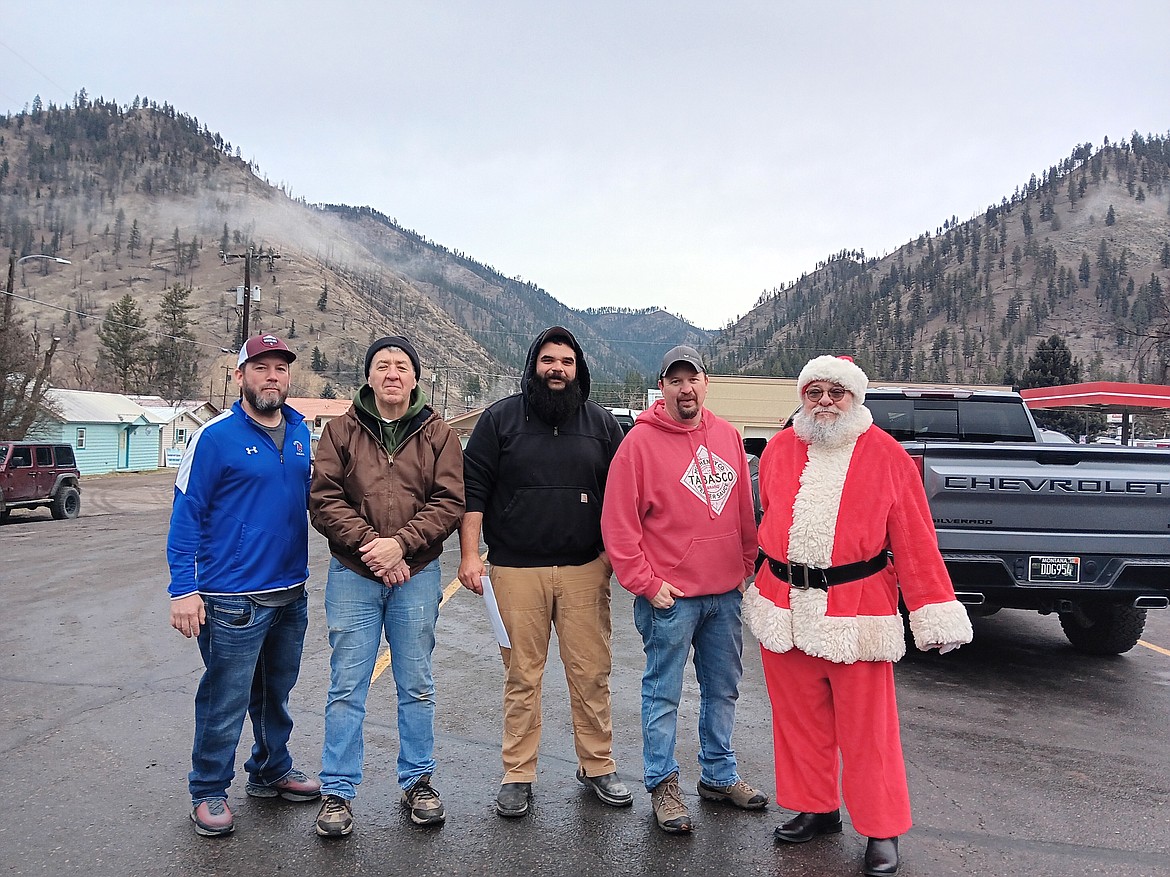 Santa Teams delivered food and presents to over 70 families in Mineral County on Saturday. The Superior LIONS have been key players in this event with so many other organizations and volunteers behind the scenes. (Monte Turner/Mineral Independent)