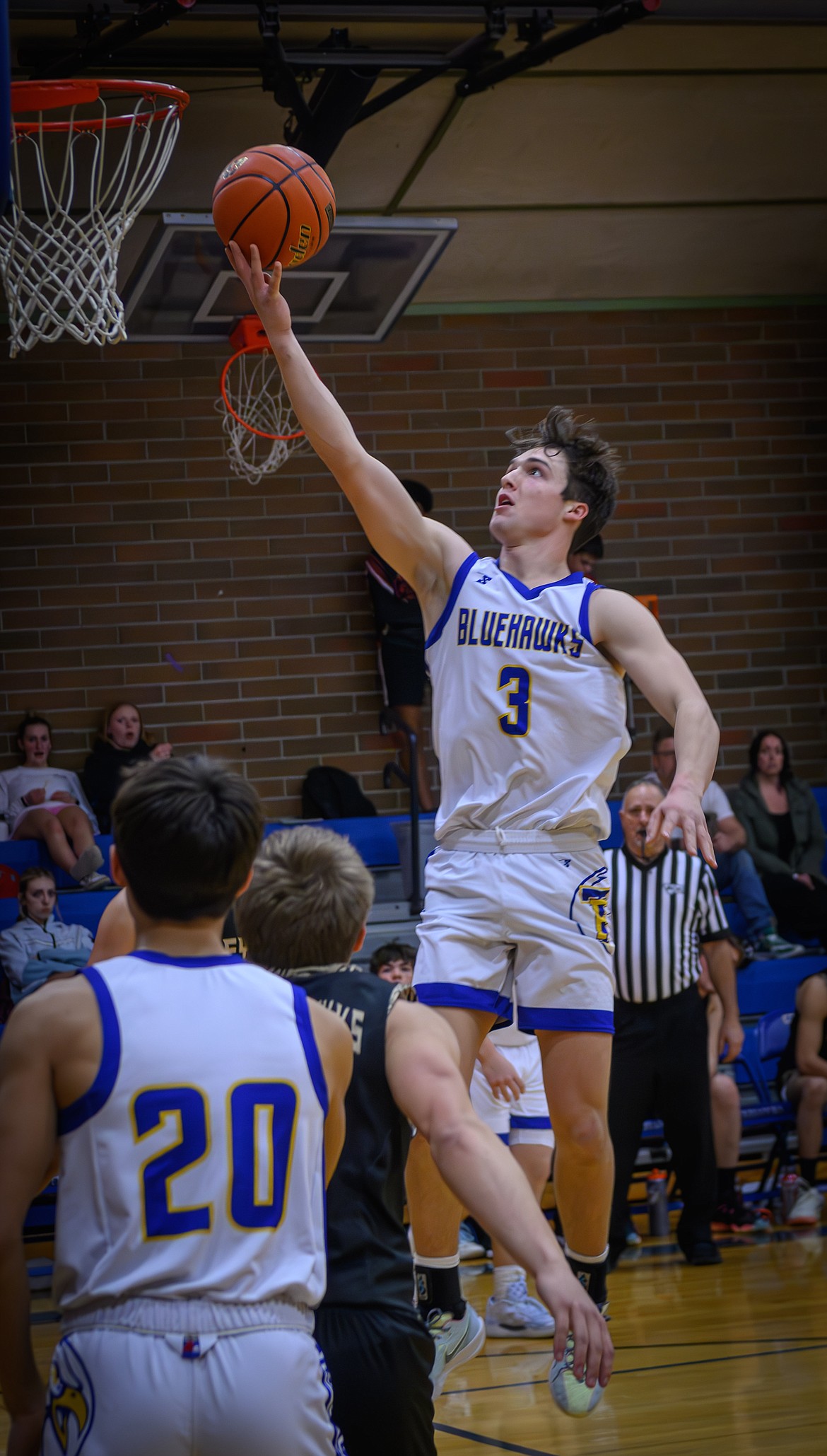 Thompson Falls senior forward Bryson LeCoure goes up for two of his game-high 24 points during the Blue Hawks' 52-45 win Friday night in T Falls.  (Photo by Tracy Scott)