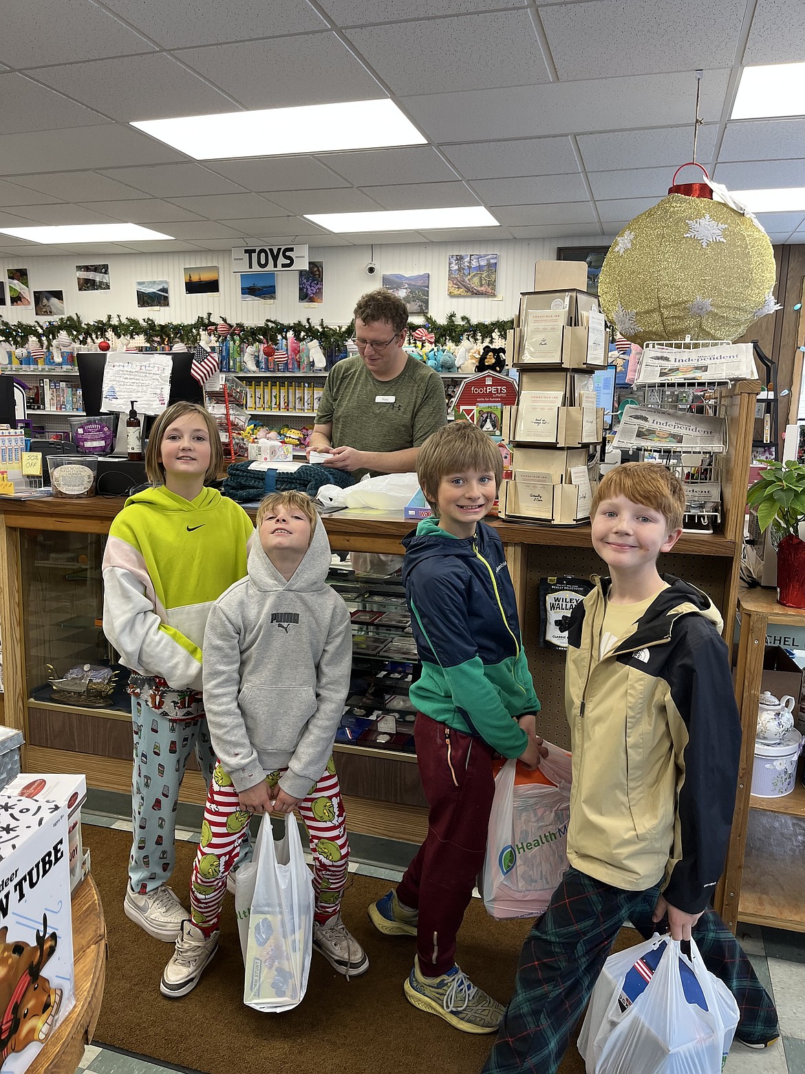 Fourth-grade students check out at Mineral Pharmacy after shopping for items to donate to local families. (Photo provided)