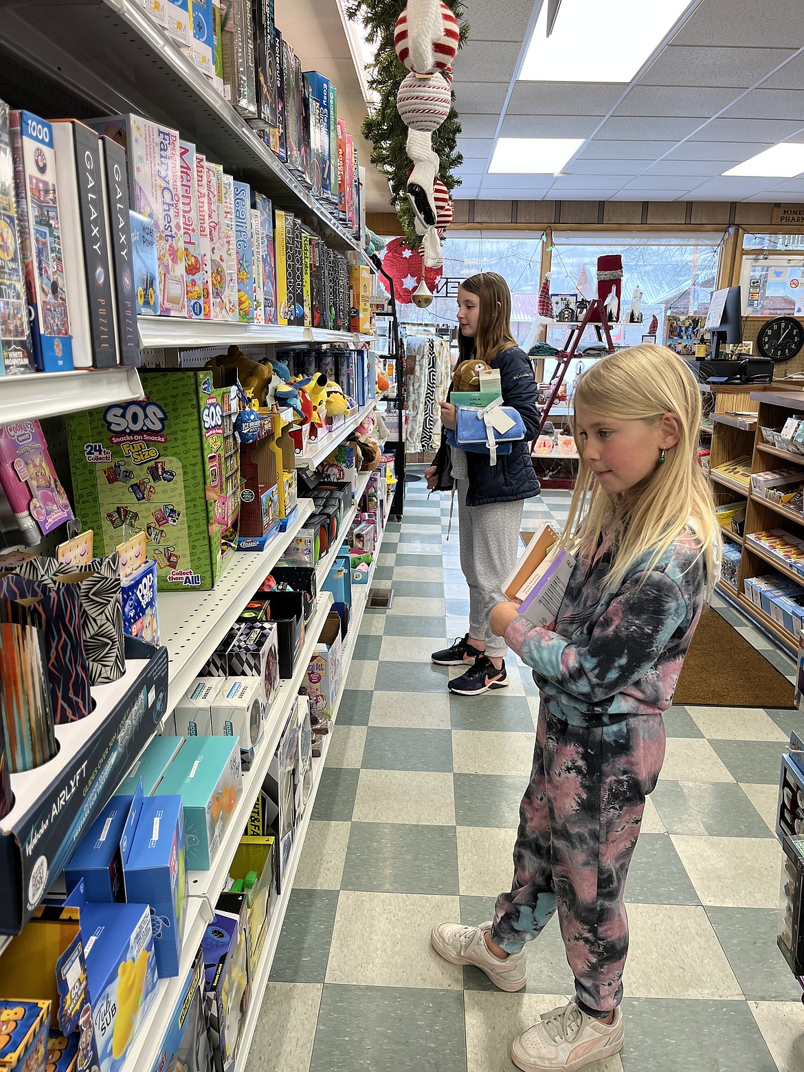 The Mineral Pharmacy was a hotspot for toy shopping last week for
Stacy Crabb's fourth-grade students at Superior Elementary. Each student had
$66.00 to spend from money raised in the community the last month for this
annual gift-giving event. (Photo provided)