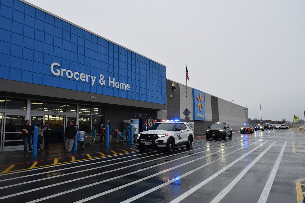 The Othello Police Department, Othello Police Explorers, Adams County Sheriff’s Office and Washington State Patrol did their annual Shop with a Cop event Saturday at the Othello Walmart. The children made their way from lunch to Walmart in police vehicles, lights flashing and sirens blaring. When they arrived at Walmart, the officers made several laps around the parking lot – with a crowd gathering outside the main doors.