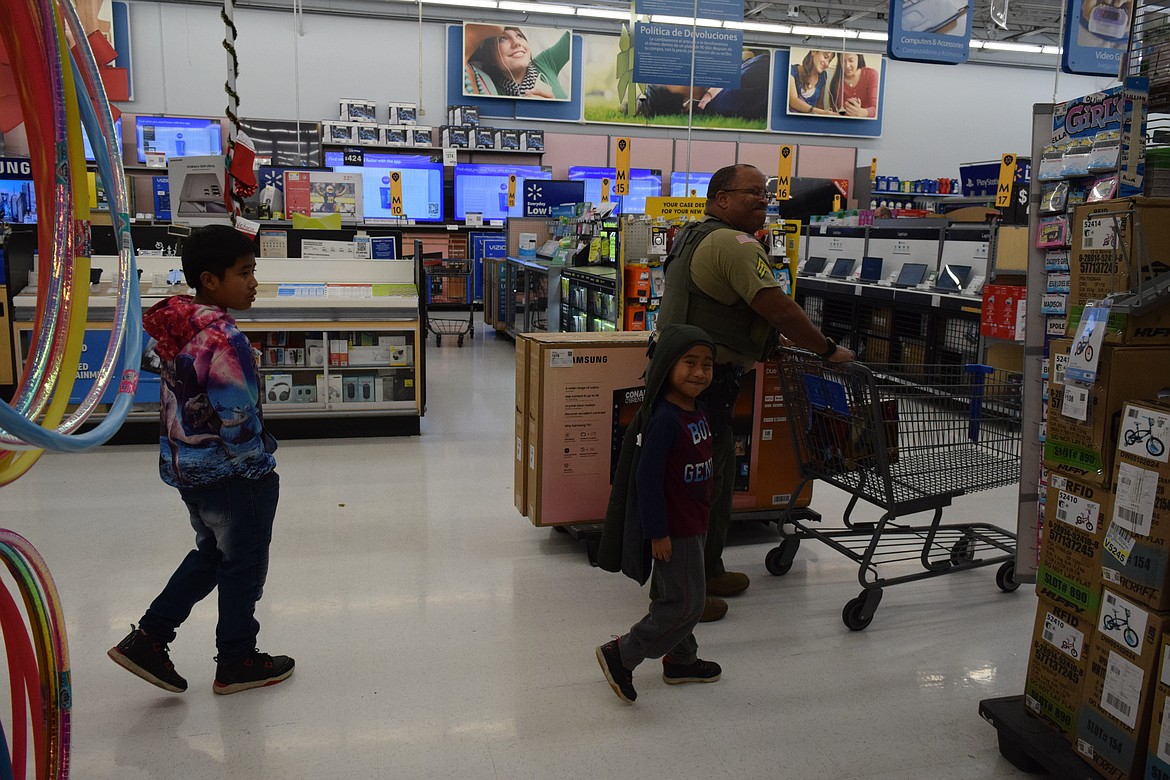 Deputy Levit and his assigned Adams County Sheriff’s Office Deputy begin their shopping journey. Levit picked out a bike, a dining table and chairs for his family and a variety of other little goods.