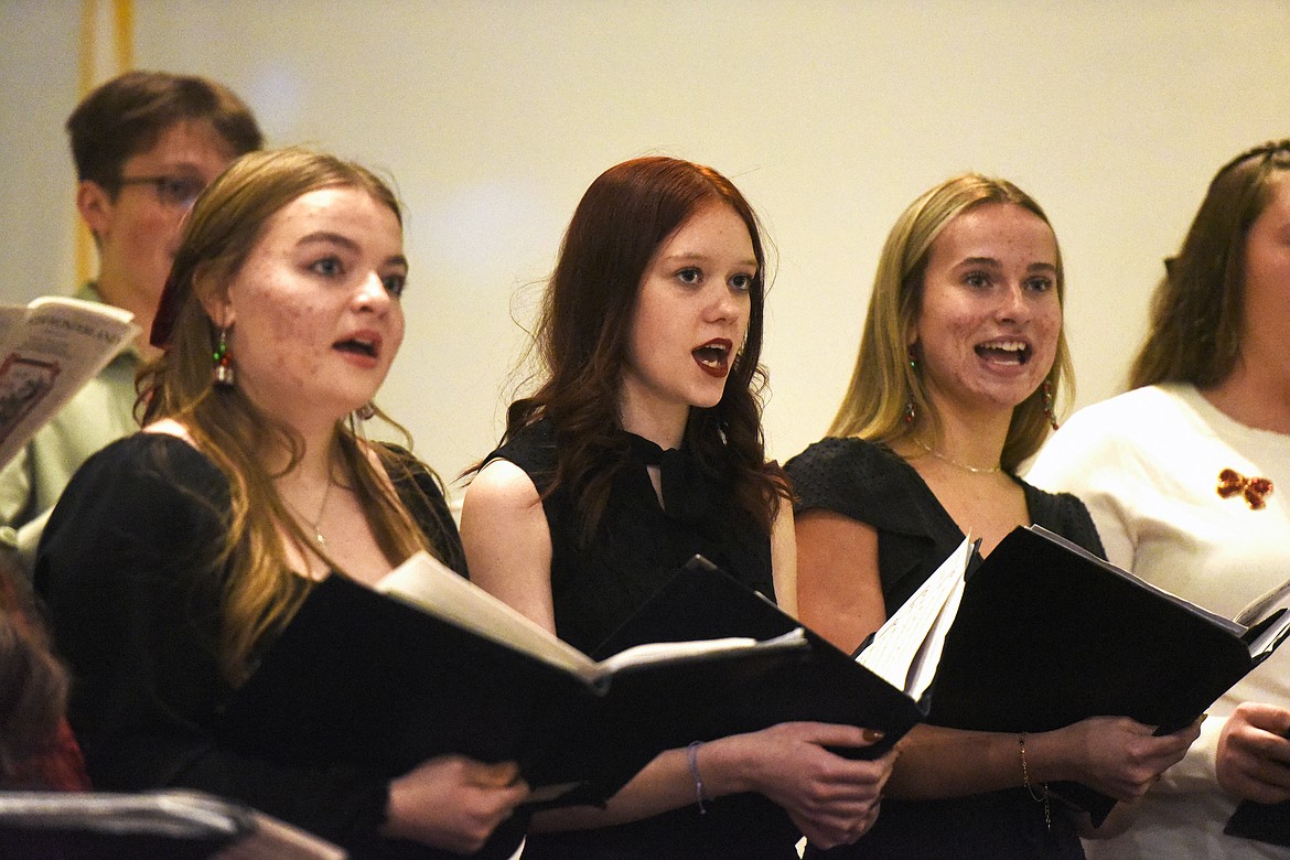 Ayla Wermer, Dylynne Cosand, and Tatum Butler in the High School choir performance. (Avery Howe/Bigfork Eagle)