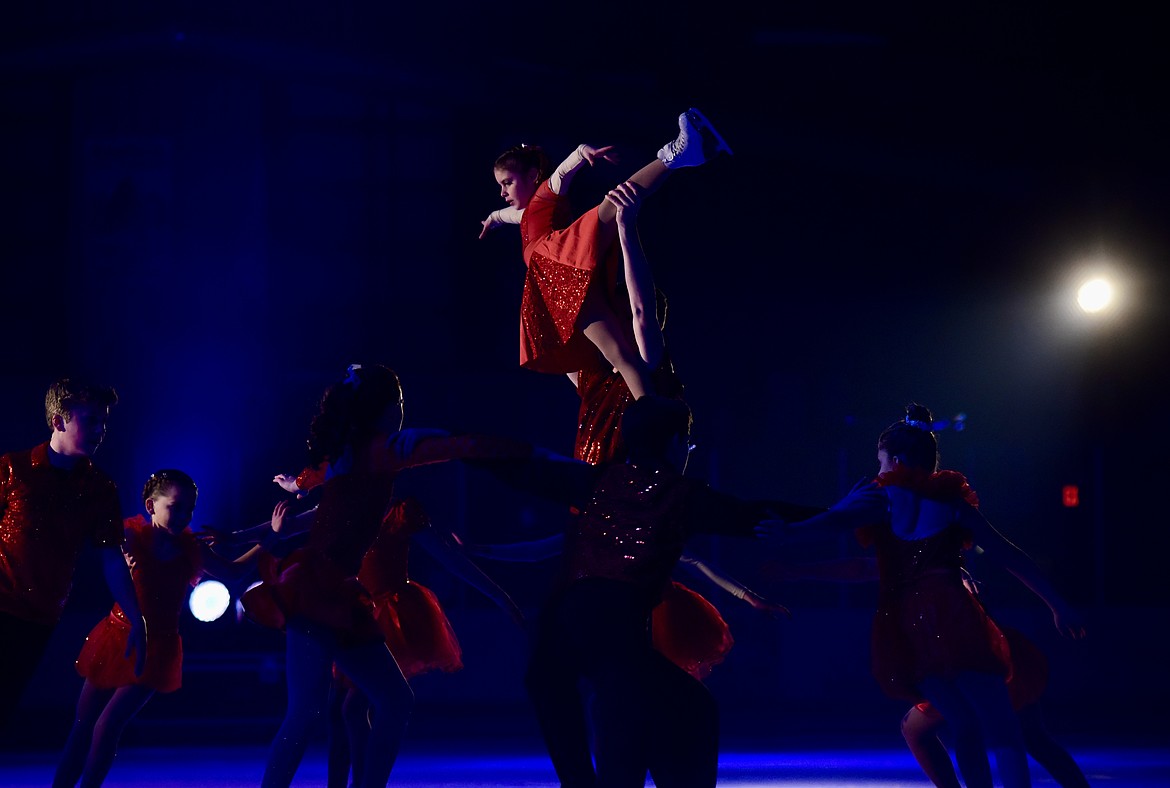 Faith Hall is hoisted high at Glacier Skate Academy's Wonderland On Ice show Saturday, Dec. 21 at Stumptown Ice Den in Whitefish. (Matt Baldwin/Whitefish Pilot)