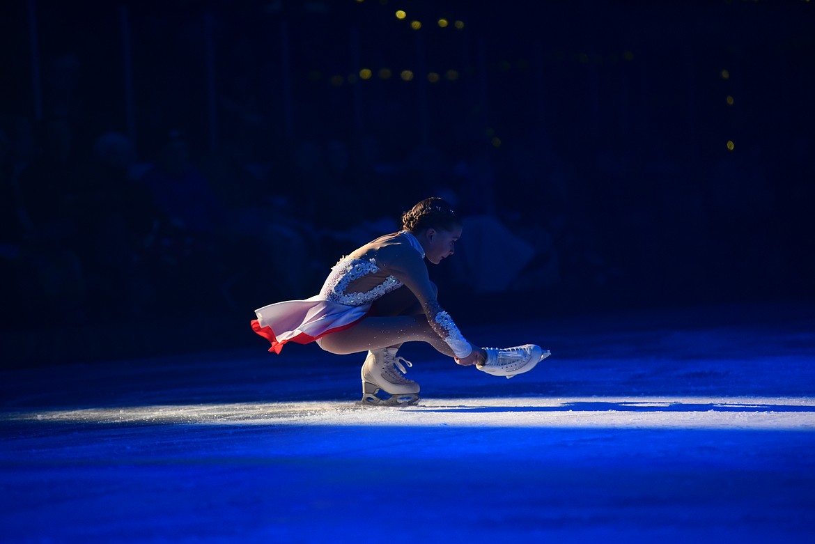 Audrey Heslop in a perfect sitspin at Glacier Skate Academy's Wonderland On Ice show Saturday, Dec. 21 at Stumptown Ice Den in Whitefish. (Matt Baldwin/Whitefish Pilot)