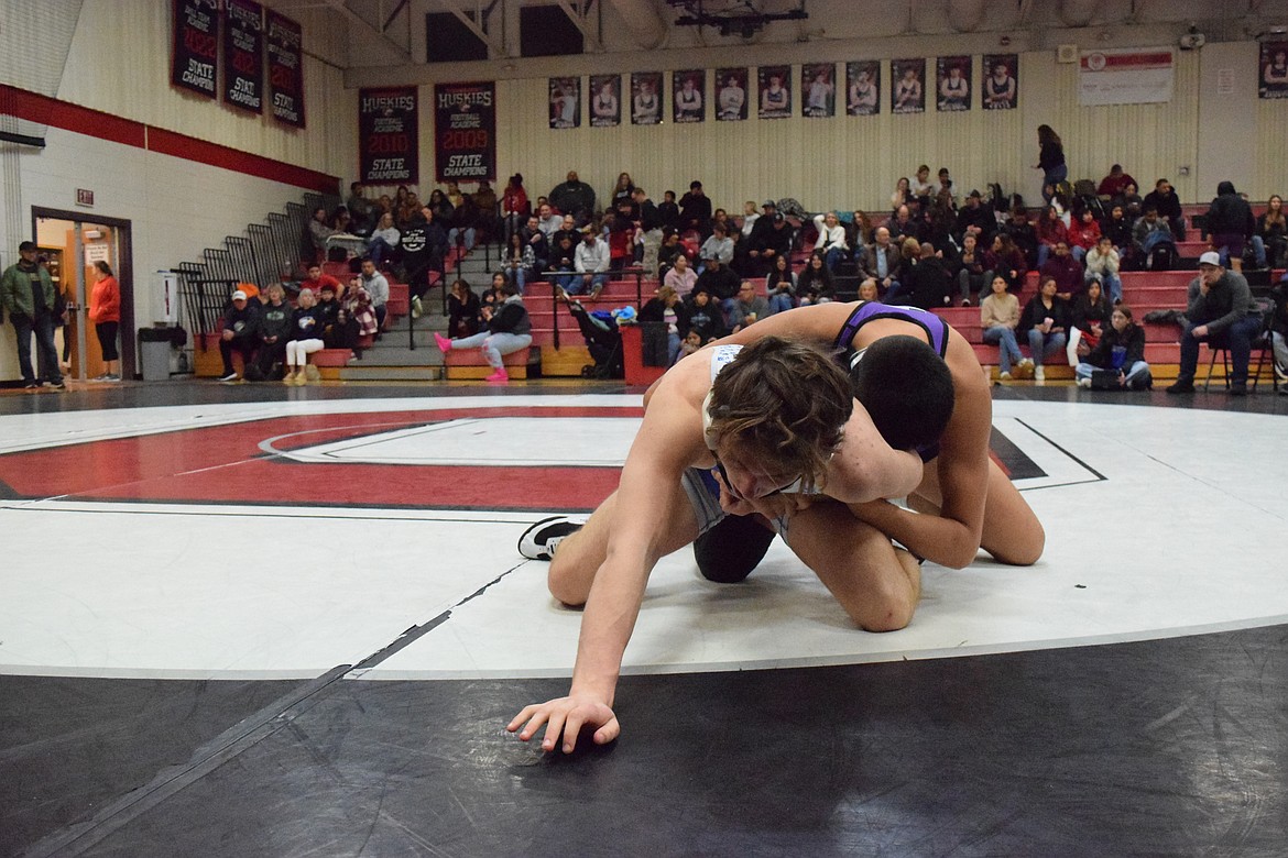 Wrestlers from Deer Park and Connell battle against one another on the mat at Saturday’s Leonard Schutte Round Up in Othello.