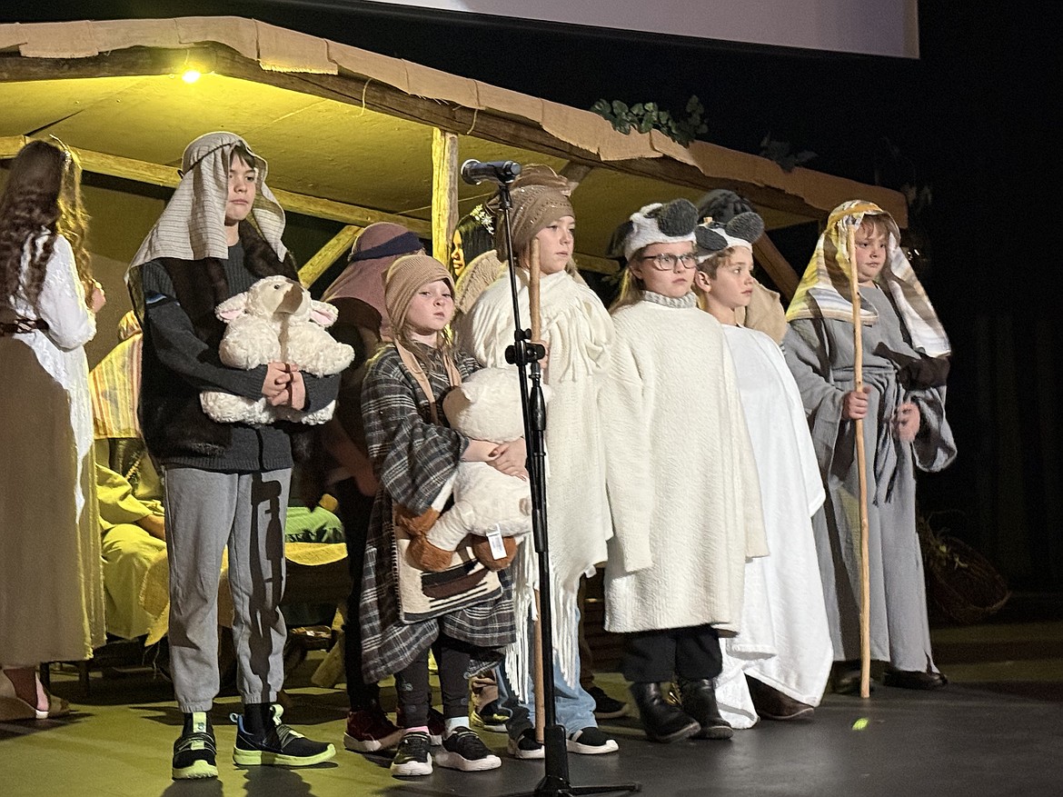 Shepherds and their flocks come to the stable in Bethlehem in the Living Nativity pageant in Mattawa.