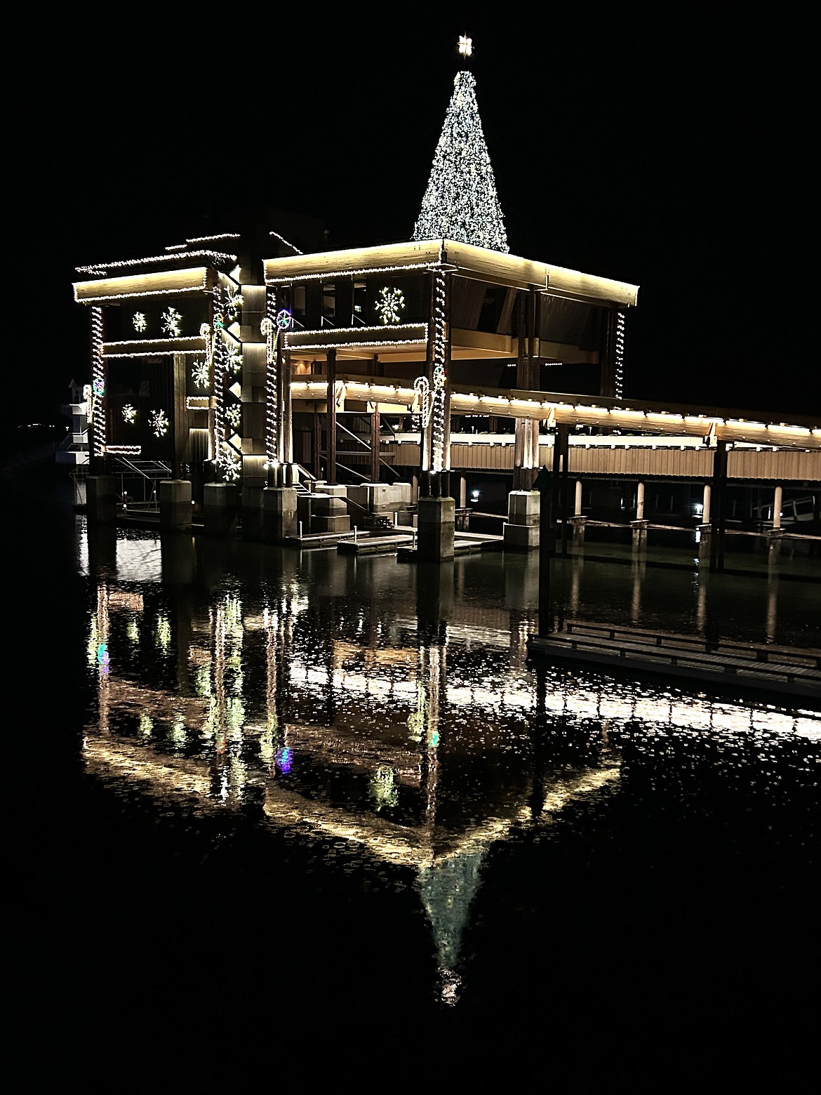 Raindrops create ripples on Lake Coeur d'Alene just outside The Hagadone Corp. headquarters on Sunday.