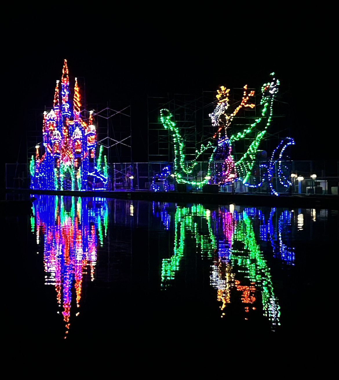 Christmas light displays reflect on Lake Coeur d'Alene at The Boardwalk Marina on Sunday.