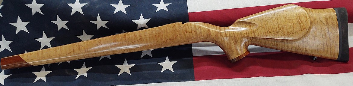 Hardwood gunstocks made by Tech Woods in Ronan are transformed by gun manufacturers around the world into tough, beautiful products like the rifle stock shown above. (Photo courtesy of Tech Woods)