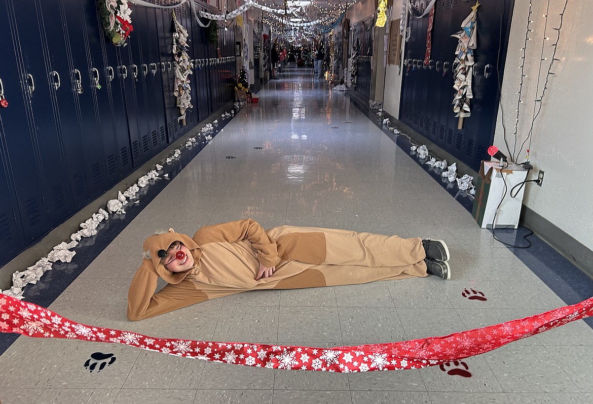 Landon Smith sports a reindeer costume for the "Deck the Halls" competition at Lakes Middle School.