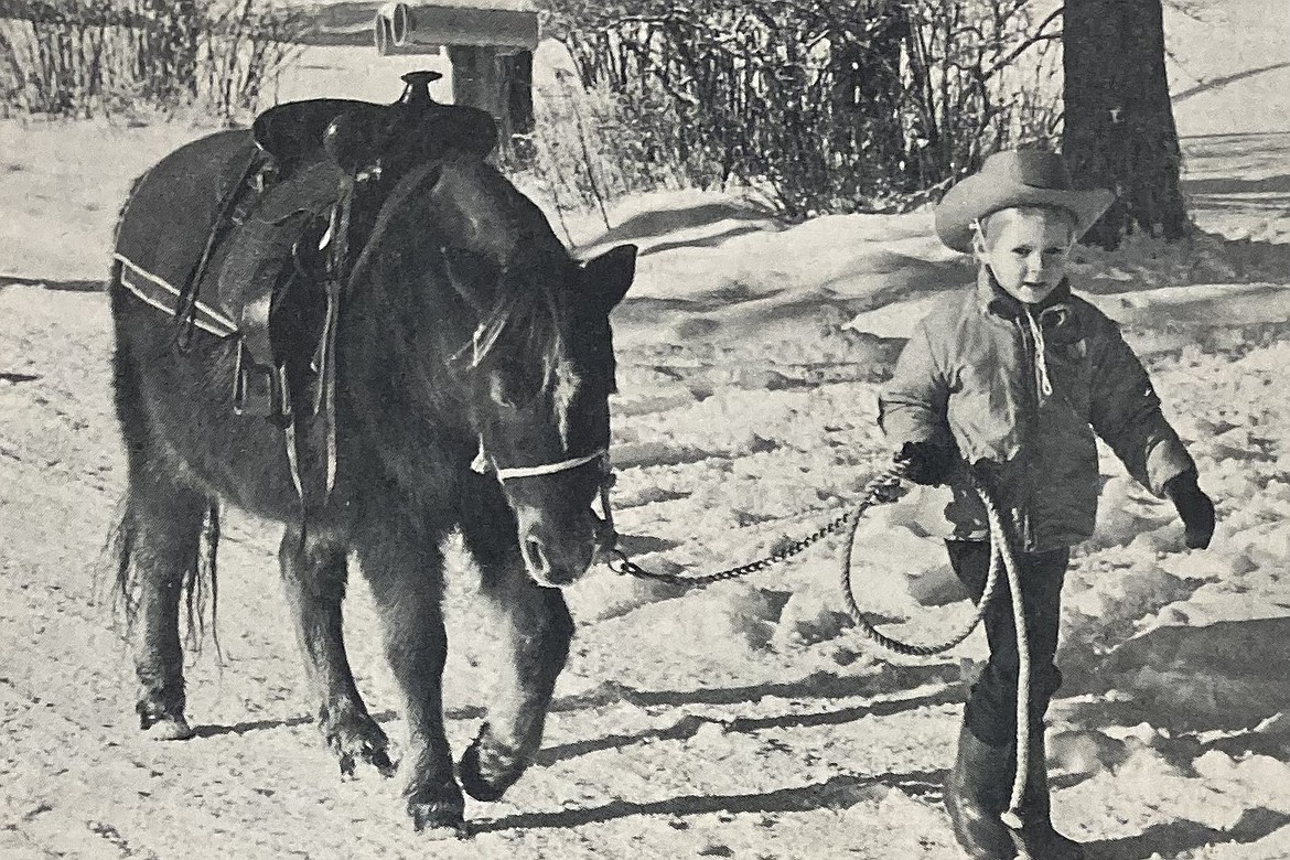 In 1964, Christy Steinley, 4, walks her Shetland, Teeney.