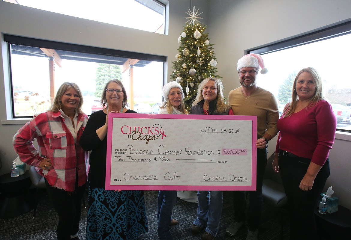 Chicks n' Chaps Coeur d'Alene donated $10,000 to the Beacon Cancer Care Foundation on Monday to support patients as they go through cancer treatment. From left: Crissy Schinmann, Julie Durrant, Melanie Goularte, Karen Lynch, Dr. David Bartels and Ann Siebert.