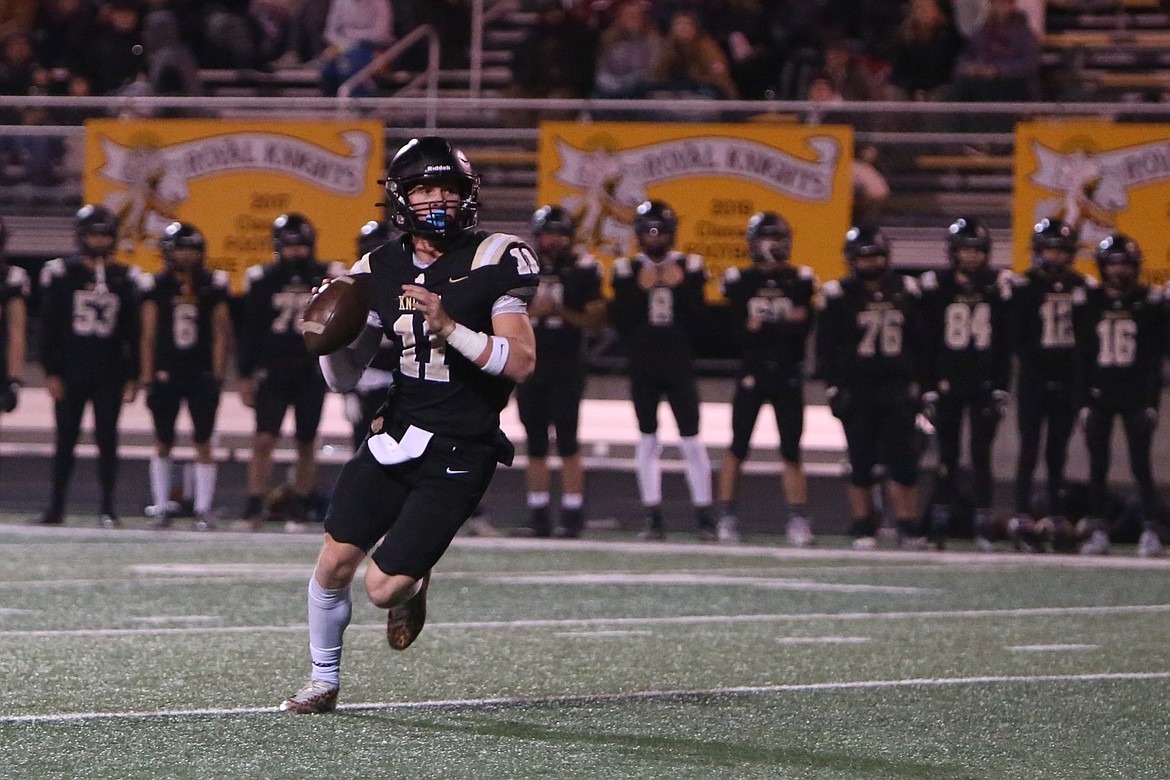 Royal senior Lance Allred drops back to pass against Klahowya in the Week 10 state crossover matchup. Allred threw for nearly 2,500 yards and 40 touchdowns this season.