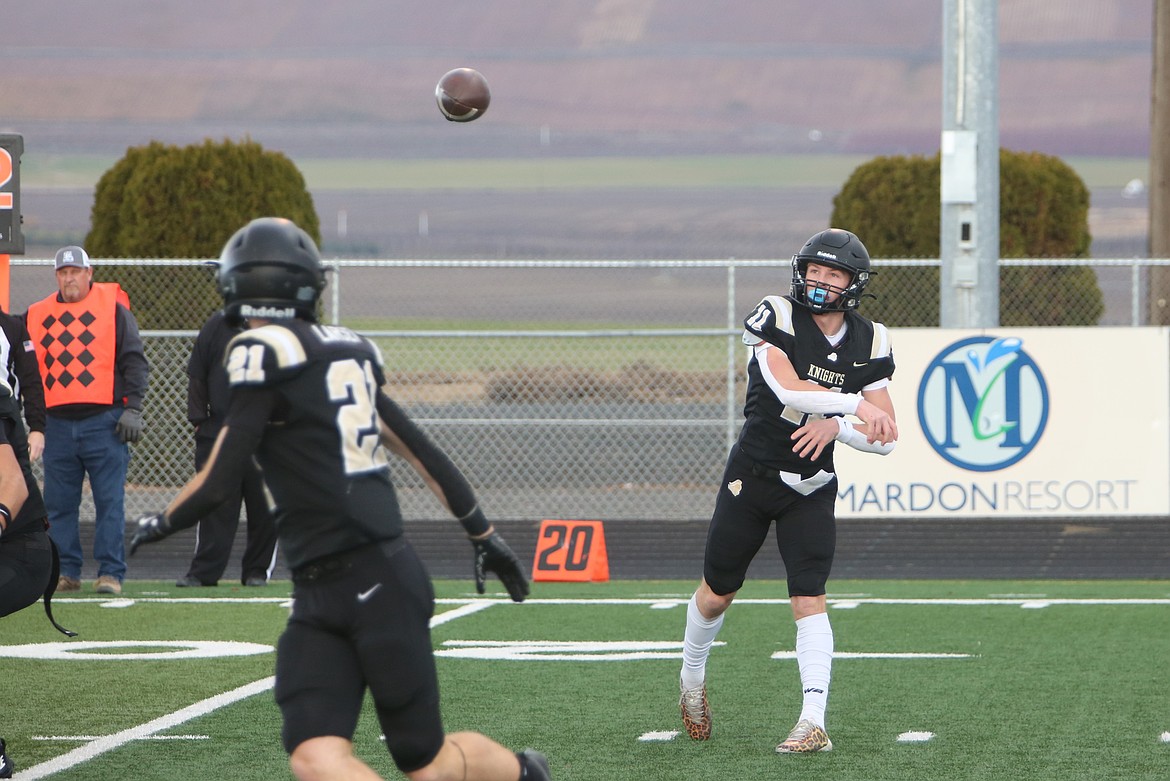 Royal senior Lance Allred (11) throws a pass into the flat to fellow senior Jackson Larsen, left. Allred’s completion percentage was a standout statistic, Head Coach Wiley Allred said.