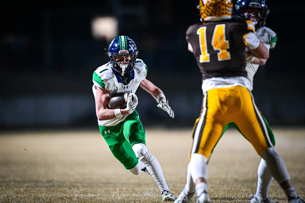 GLACIER RECEIVER Bridger Smith picks up extra yardage after a catch during the State AA championship against Helena Capital on Nov. 22 at Vigilante Stadium in Helena. (Casey Kreider/Daily Inter Lake)