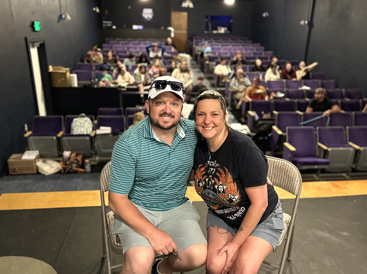 Brooke and Damon Wood sit on the stage of the Lake City Playhouse in June as the cast rehearses songs for "Oliver."