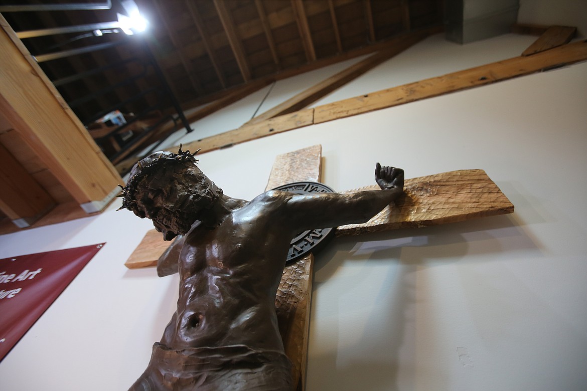 A depiction of Jesus Christ on the cross is seen Friday in Cheryl Metcalf's studio.