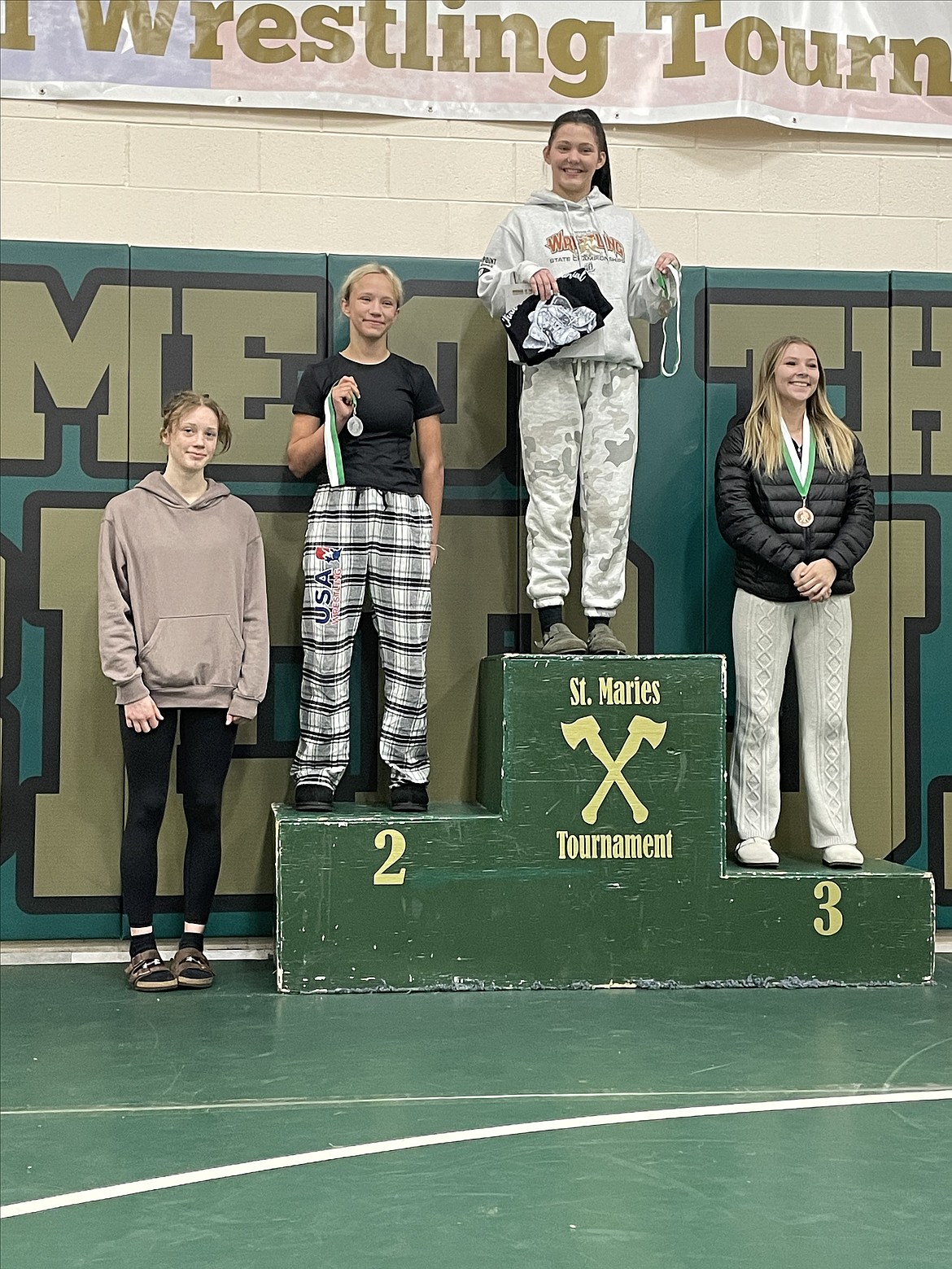 From left, Sienna Omodt (fourth), Hunter Edmondson (second), Emma Garman (first) and Nya Eby (third), all from Sandpoint, swept the 120-pound weight class at the Chad E. Ross Invitational held at St. Maries High this past Saturday.